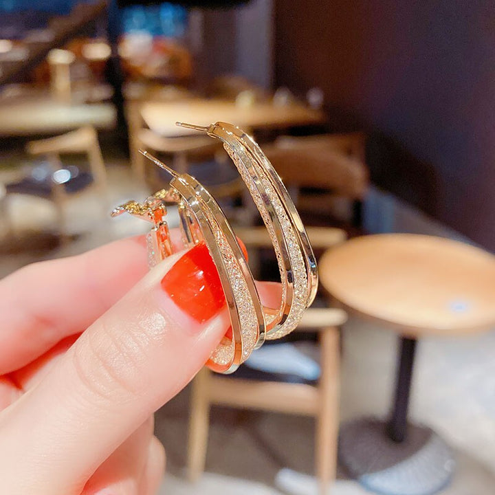 Donna | Oval glossy hoop earrings